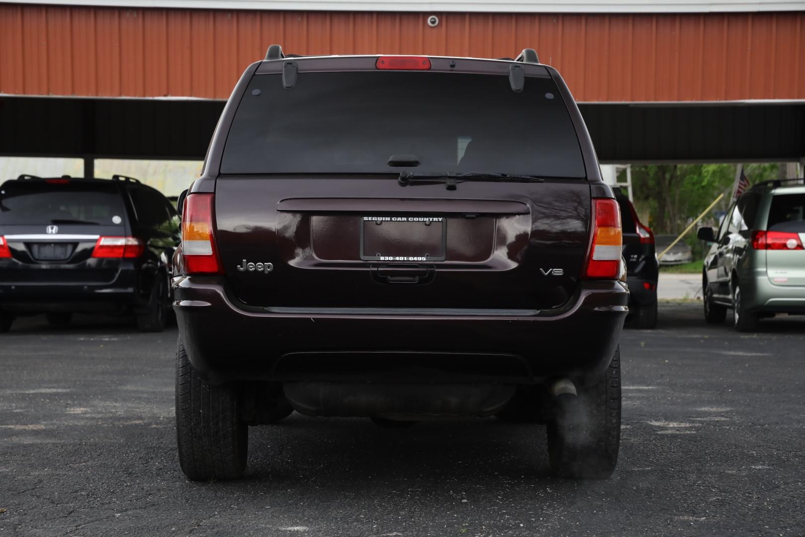 2004 PURPLE JEEP GRAND CHEROKEE Limited 2WD (1J8GX58N44C) with an 4.7L V8 SOHC 16V engine, 4-SPEED AUTOMATIC OR 5-SPEED AUTOMATIC transmission, located at 420 E. Kingsbury St., Seguin, TX, 78155, (830) 401-0495, 29.581060, -97.961647 - Photo#5